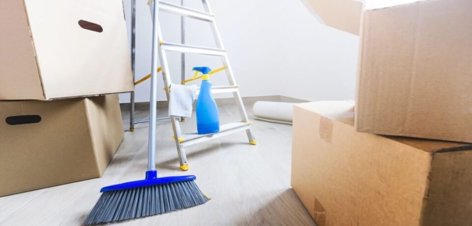 Empty room full of cardboard boxes and cleaning things for moving into a new home